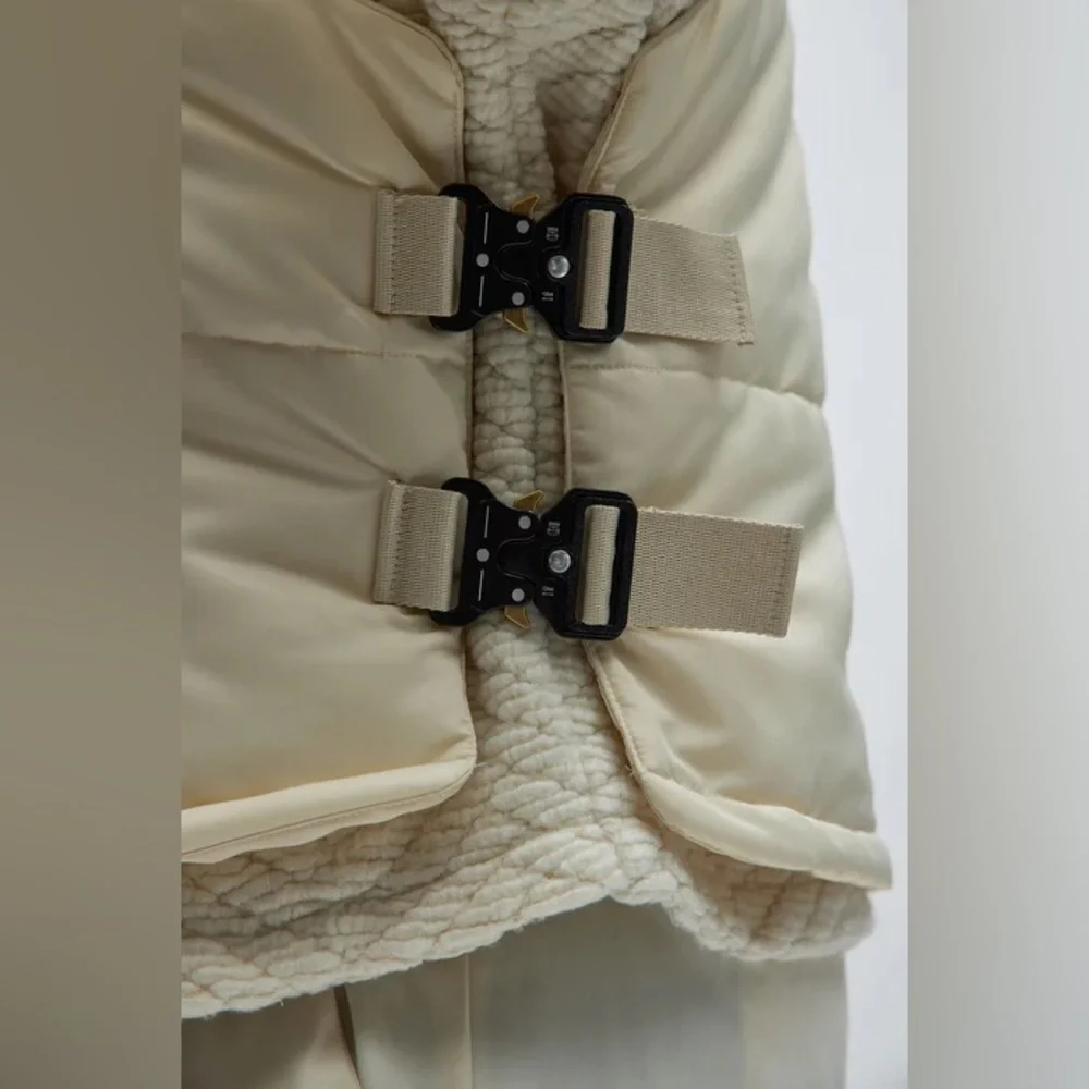 Roller Coaster Puffer Vest" in Off White from the brand Fashion Nova. - Picture 10 of 10
